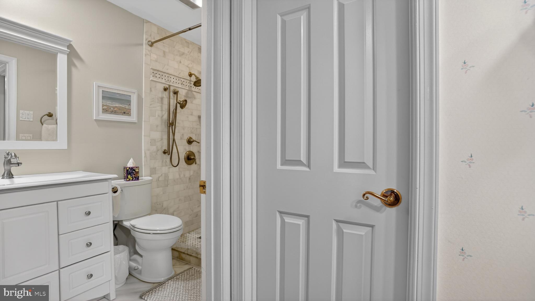 317 Canterfield Road Annapolis, MD 21403 - Photo 31 of 66 a bathroom with a toilet a sink and shower
