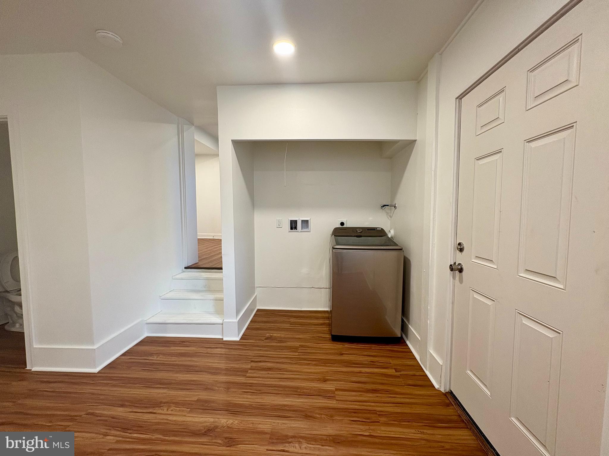 758 Fremont Street Lancaster, PA 17603 - Photo 11 of 20 a view of a refrigerator in kitchen and wooden floor