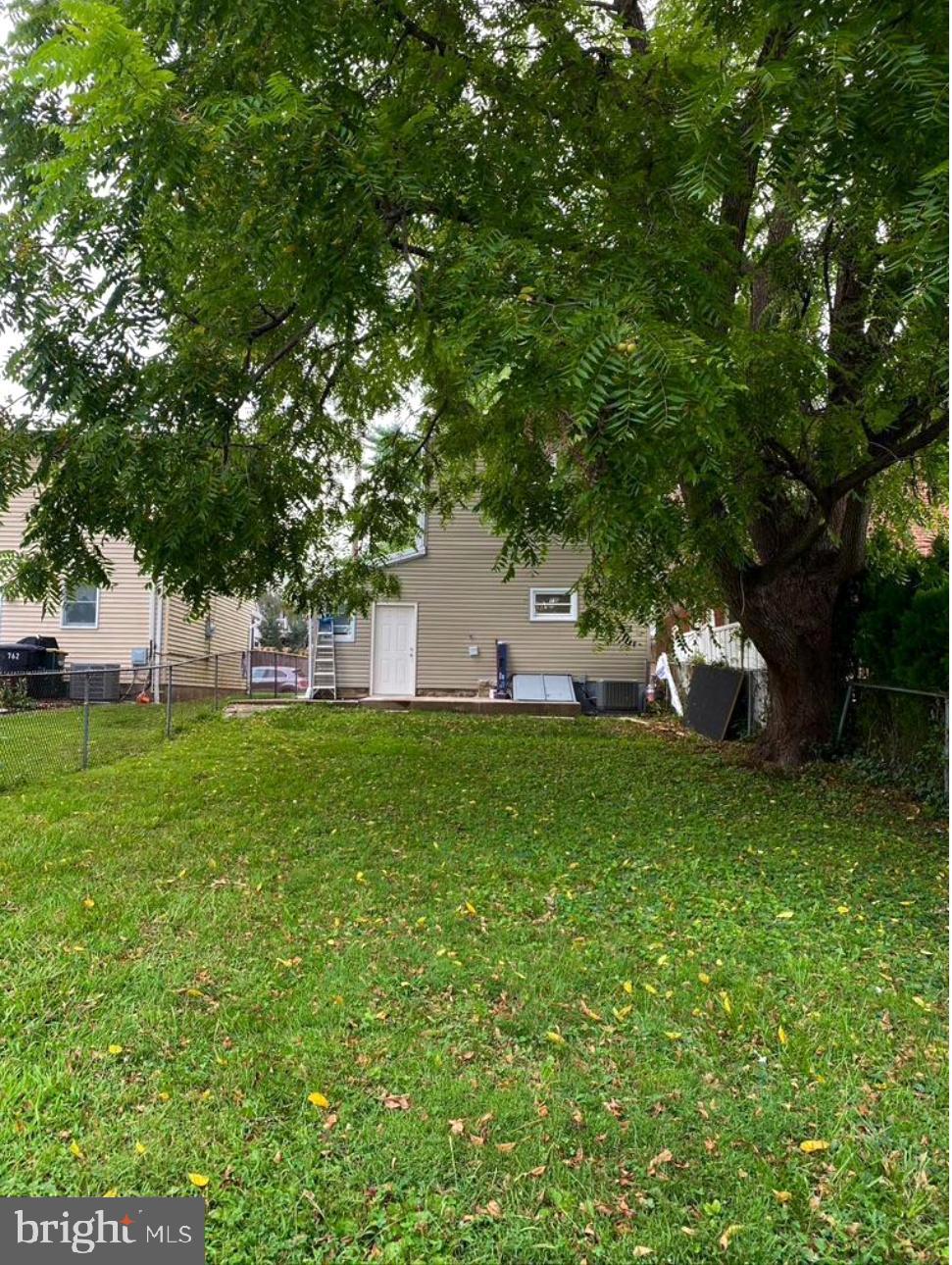 758 Fremont Street Lancaster, PA 17603 - Photo 18 of 20 a backyard of a house with table and chairs plants and large tree