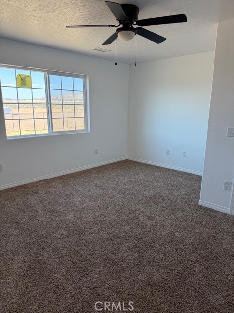16925 Nanticoke Road Apple Valley, CA 92307 - Photo 20 of 87 an empty room with windows