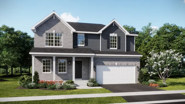 a front view of a house with a yard and trees