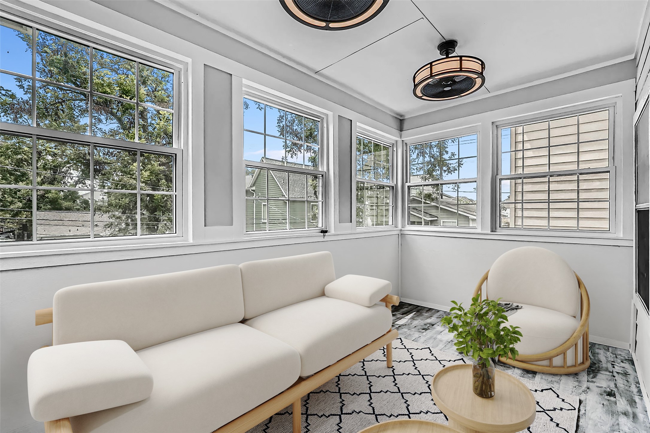 806 East 29th Street Houston, TX 77009 - Photo 15 of 30 Bright sunroom with large windows, modern light fixtures. Perfect for relaxation with a view of the outdoors. *This photo is virtually staged.