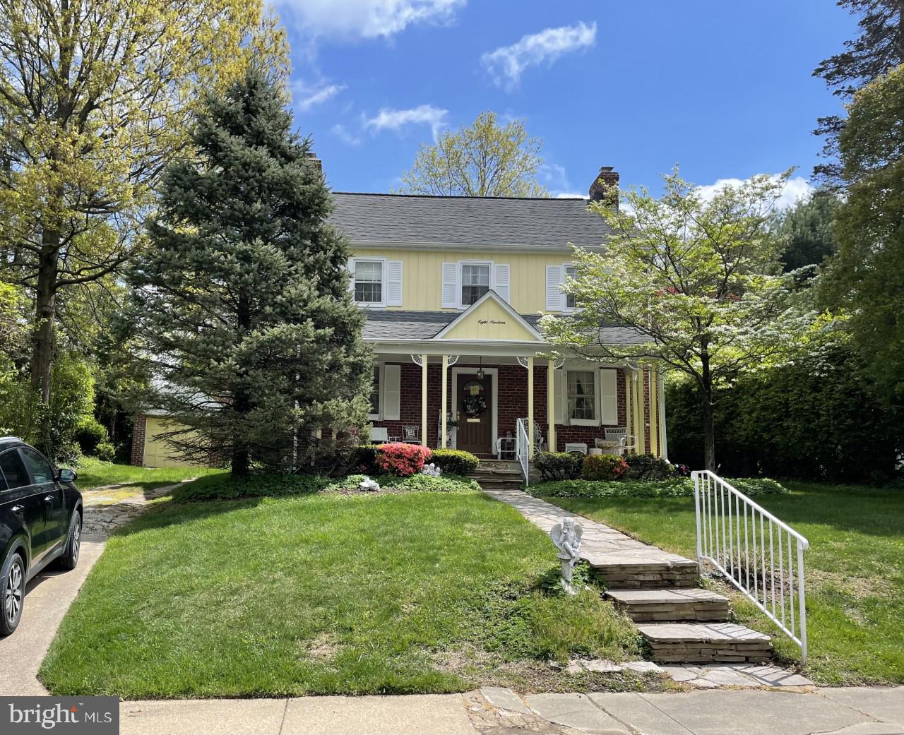 Front porch Colonial overlooking community pool.