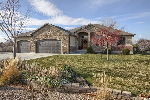 3777 Spiral Springs Road Erda, UT 84074 - Photo 1 of 1 View of front of property with a front yard and a garage