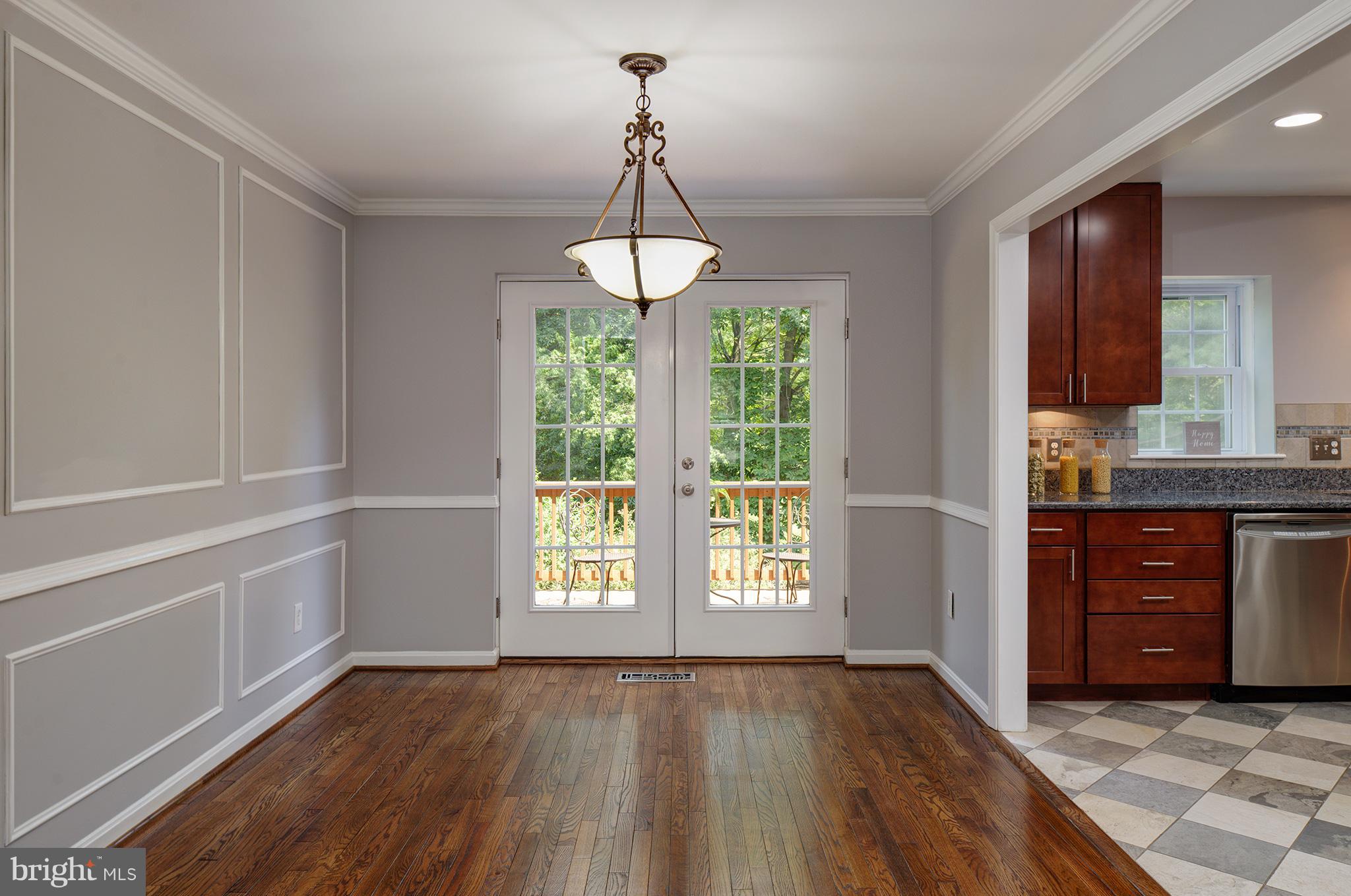 2107 Golf Course Drive Reston, VA 20191 - Photo 5 of 21 DINING ROOM OPENS TO DECK AND GREEN COMMON SPACE