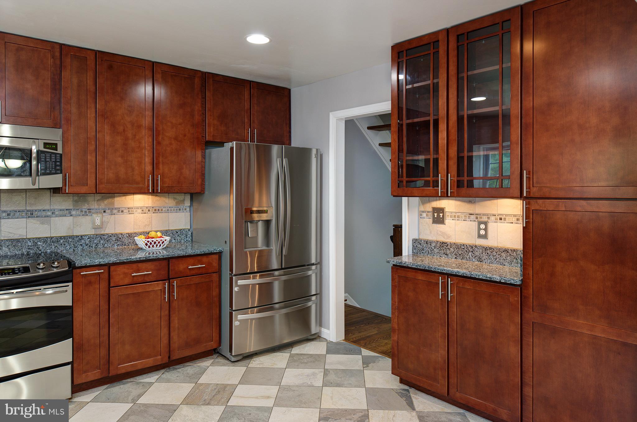 2107 Golf Course Drive Reston, VA 20191 - Photo 10 of 21 KITCHEN OPENS TO HALLWAY TO LOWER LEVEL