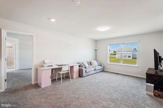 a bed room with a bed and a window