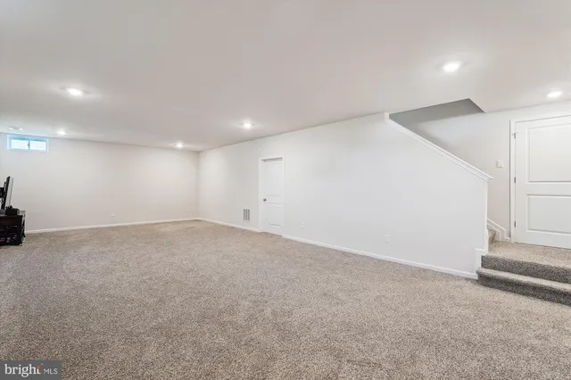 a view of a lake with a house in the background