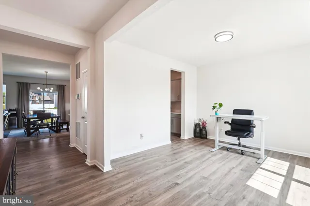 a workspace with furniture and a window