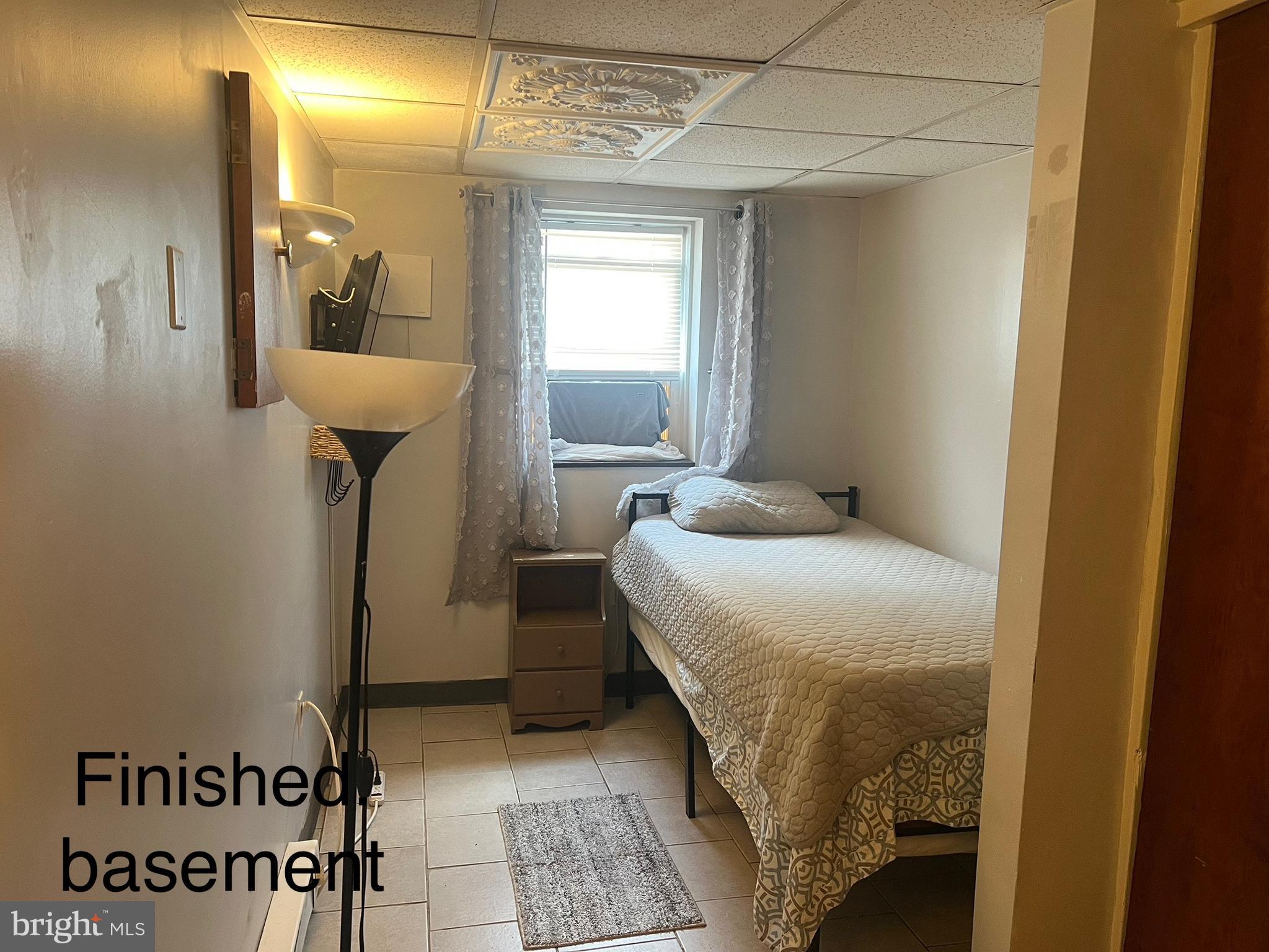 539 Timberlake Road Upper Darby, PA 19082 - Photo 14 of 17 a bedroom with a bed and a mirror