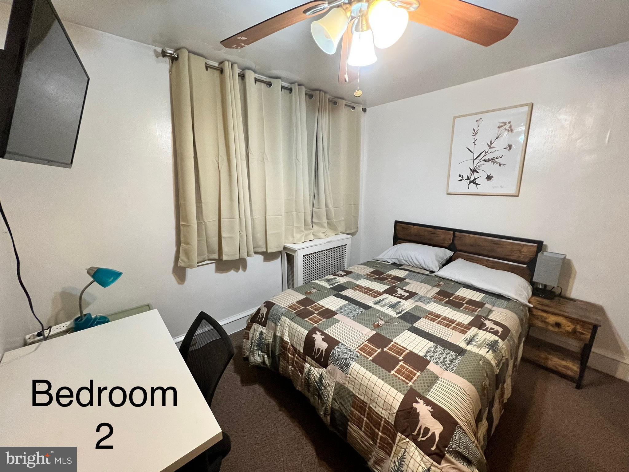539 Timberlake Road Upper Darby, PA 19082 - Photo 10 of 17 a bedroom with a bed and a chandelier