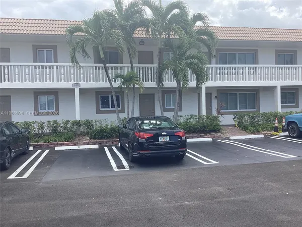 a kitchen with stainless steel appliances granite countertop a sink and a stove