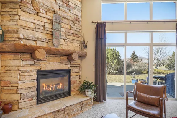 a living room with lots of furniture and kitchen view