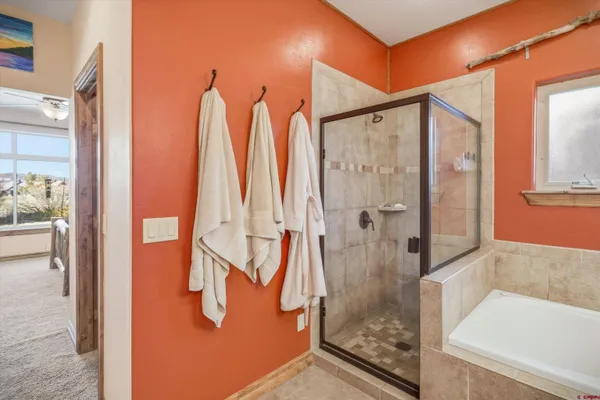 an aerial view of a house with a yard and outdoor seating