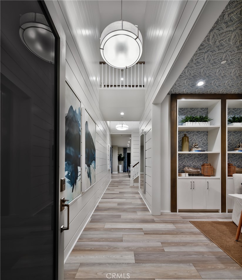 27562 Elderberry Drive Valencia, CA 91381 - Photo 2 of 18 a view of a hallway with a chandelier and livingroom view