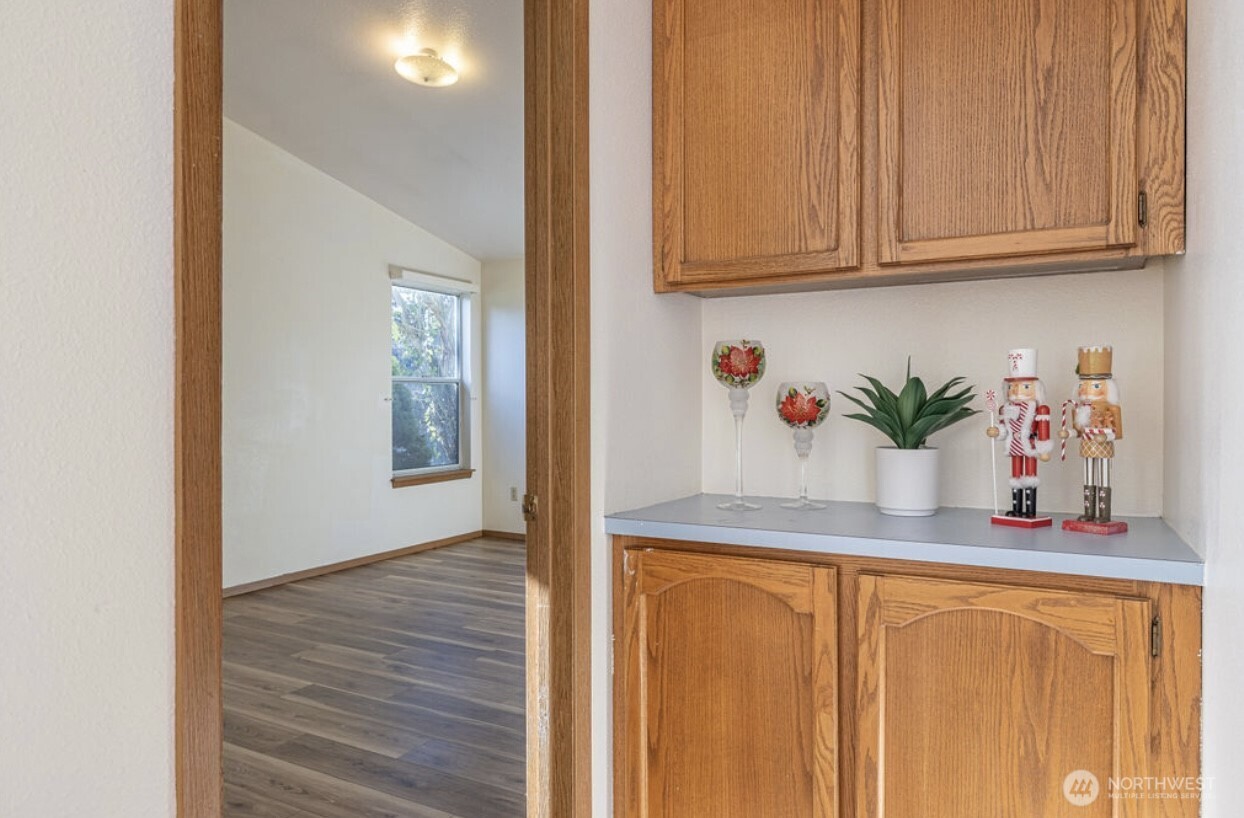 11209 Southeast 267th Place Kent, WA 98030 - Photo 18 of 27 a kitchen with stainless steel appliances granite countertop cabinets and wooden floor