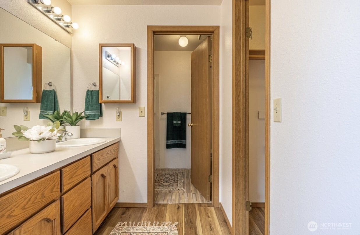 11209 Southeast 267th Place Kent, WA 98030 - Photo 19 of 27 a bathroom with a sink and a mirror