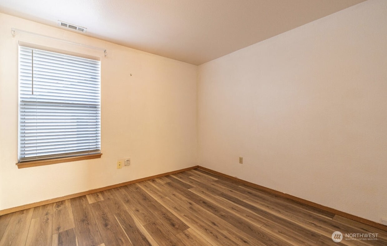 11209 Southeast 267th Place Kent, WA 98030 - Photo 24 of 27 a view of empty room with wooden floor and fan