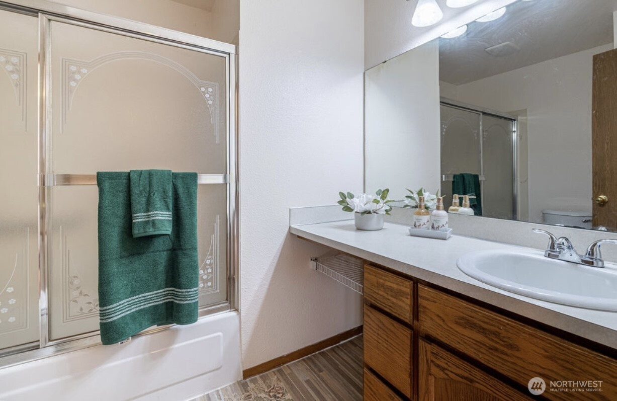 11209 Southeast 267th Place Kent, WA 98030 - Photo 25 of 27 a bathroom with a sink and a mirror