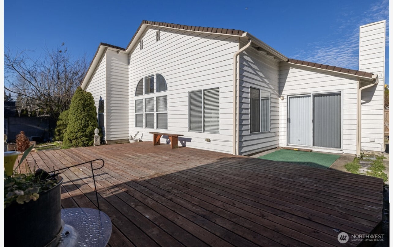 11209 Southeast 267th Place Kent, WA 98030 - Photo 26 of 27 a view of a house with backyard and sitting area