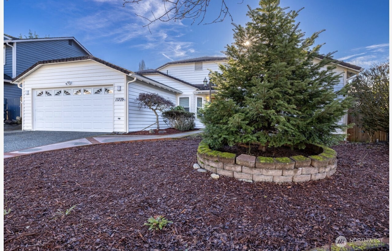 11209 Southeast 267th Place Kent, WA 98030 - Photo 3 of 27 a view of a house with a yard
