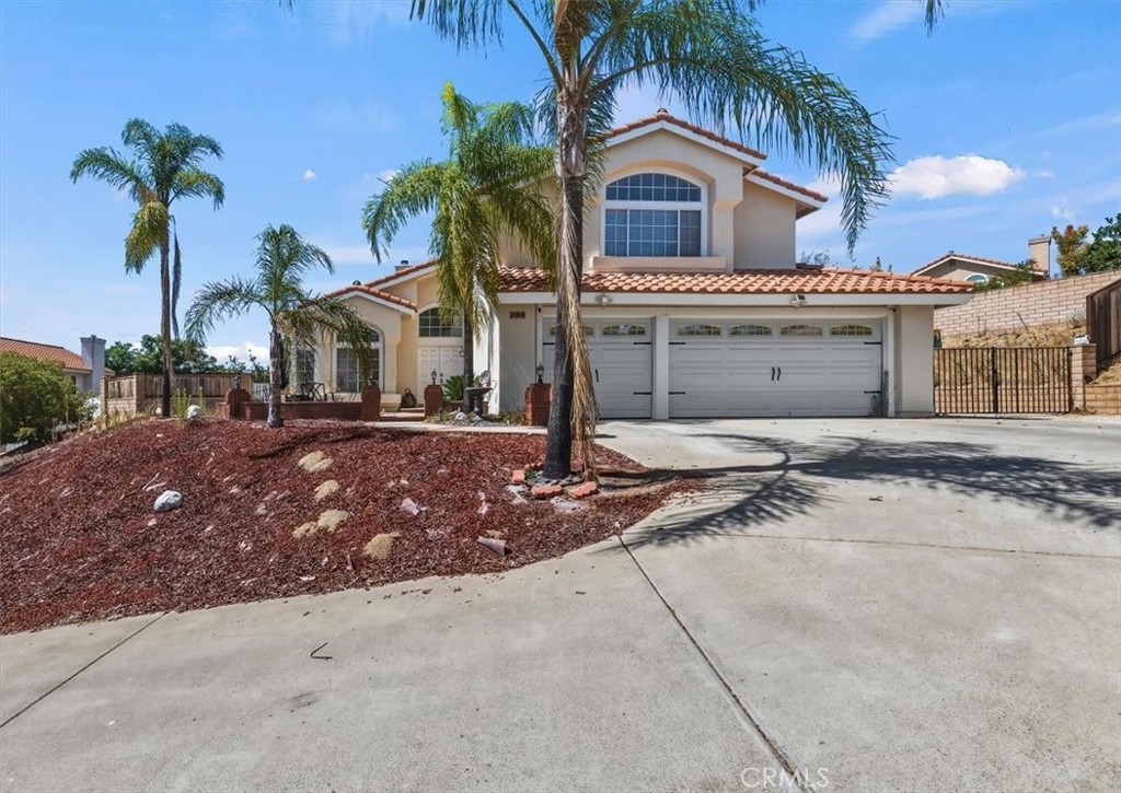 352 Leafwood Court Riverside, CA 92506 - Photo 2 of 42 a front view of a house with garden