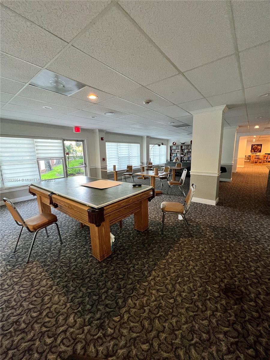 10777 West Sample Road, Unit 301 Coral Springs, FL 33065 - Photo 12 of 12 a room with pool table and windows