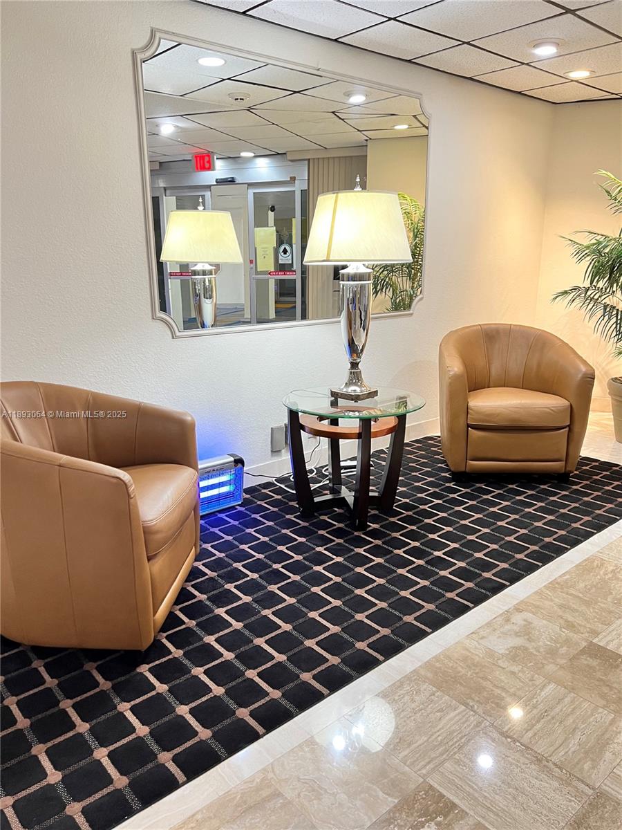 10777 West Sample Road, Unit 301 Coral Springs, FL 33065 - Photo 8 of 12 a living room with furniture