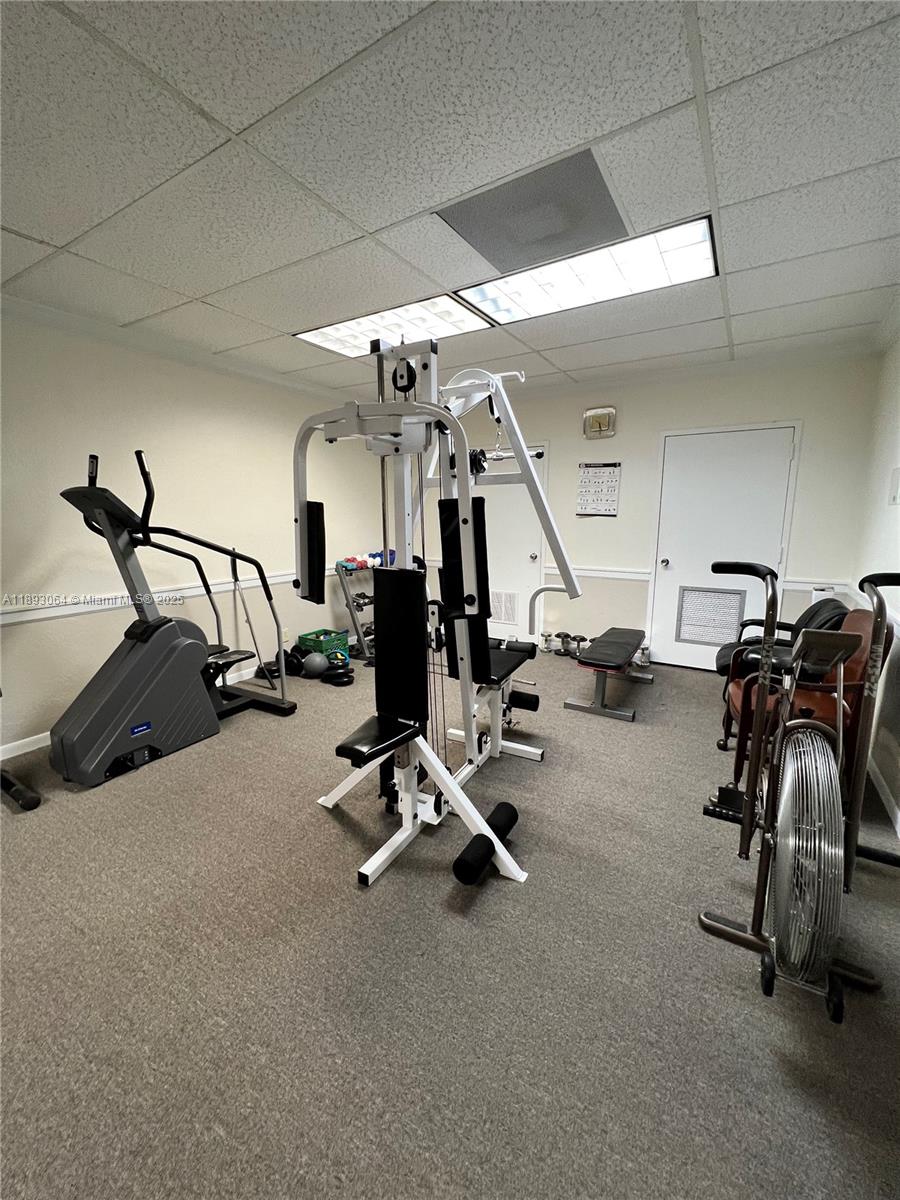 10777 West Sample Road, Unit 301 Coral Springs, FL 33065 - Photo 9 of 12 a view of a room with gym equipment