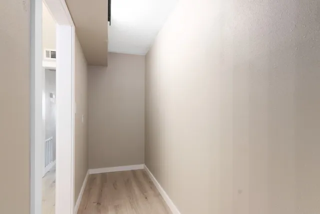 a bathroom with a double vanity sink and mirror