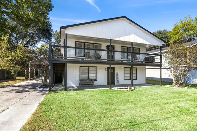 a view of a porch with furniture and a gate