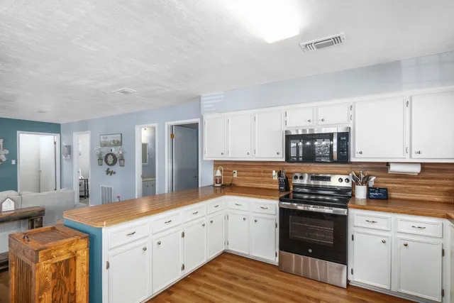 a view of an empty room with windows