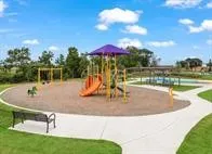 a kitchen with granite countertop a sink and a stove top oven