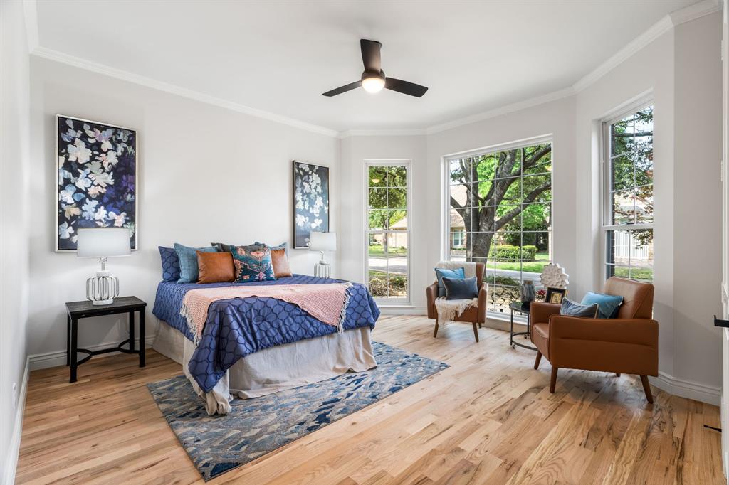 5120 Briar Tree Drive Dallas, TX 75248 - Photo 14 of 40 a bedroom with a bed and wooden floor