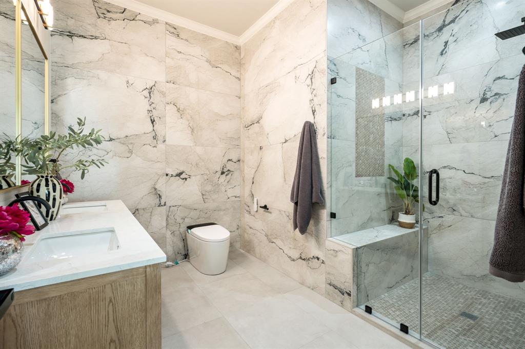 5120 Briar Tree Drive Dallas, TX 75248 - Photo 15 of 40 a bathroom with a sink a toilet and shower