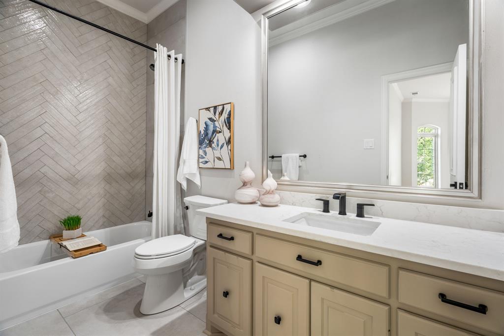 5120 Briar Tree Drive Dallas, TX 75248 - Photo 18 of 40 a bathroom with a toilet sink and mirror