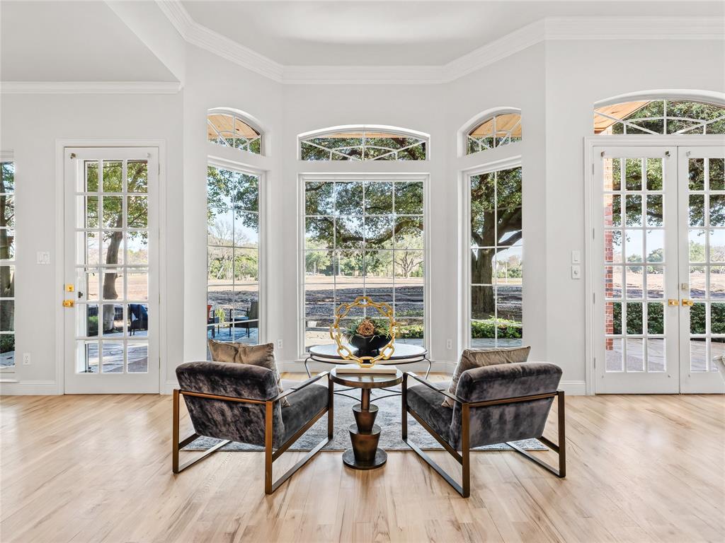 5120 Briar Tree Drive Dallas, TX 75248 - Photo 22 of 40 a living room with couches a coffee table and four couches with wooden floor