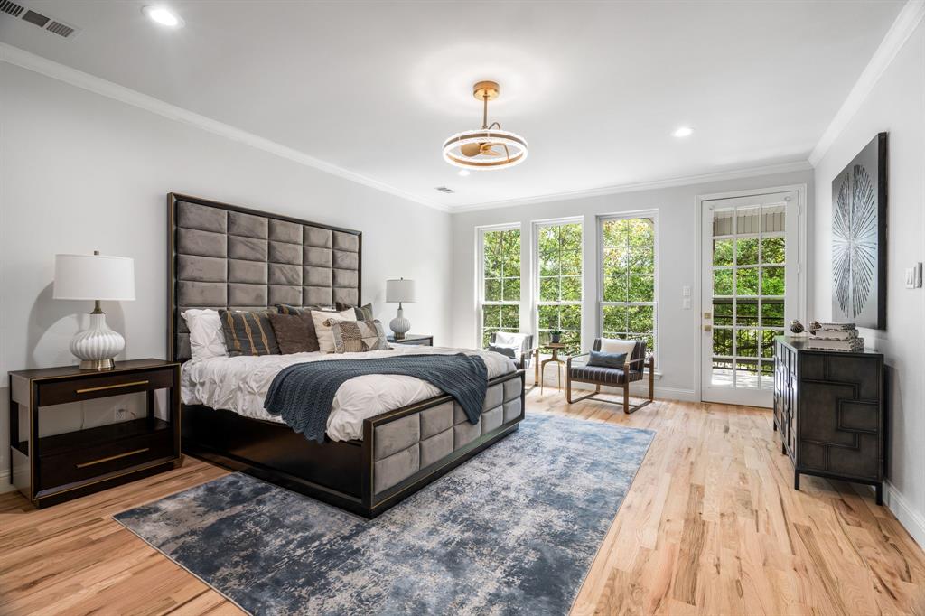 5120 Briar Tree Drive Dallas, TX 75248 - Photo 22 of 40 a bedroom with a large bed and a large window