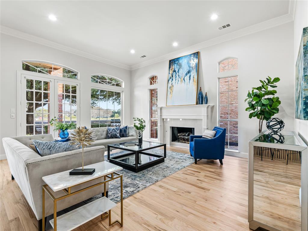 5120 Briar Tree Drive Dallas, TX 75248 - Photo 23 of 40 a living room with furniture a fireplace and a potted plant