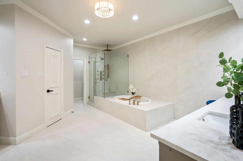 5120 Briar Tree Drive Dallas, TX 75248 - Photo 25 of 40 a spacious bathroom with a sink a shower and a mirror