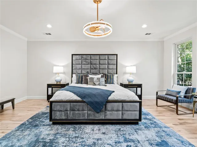 a bedroom with bed and a table