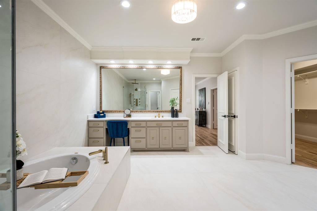 5120 Briar Tree Drive Dallas, TX 75248 - Photo 26 of 40 a large bathroom with a tub sink and mirror