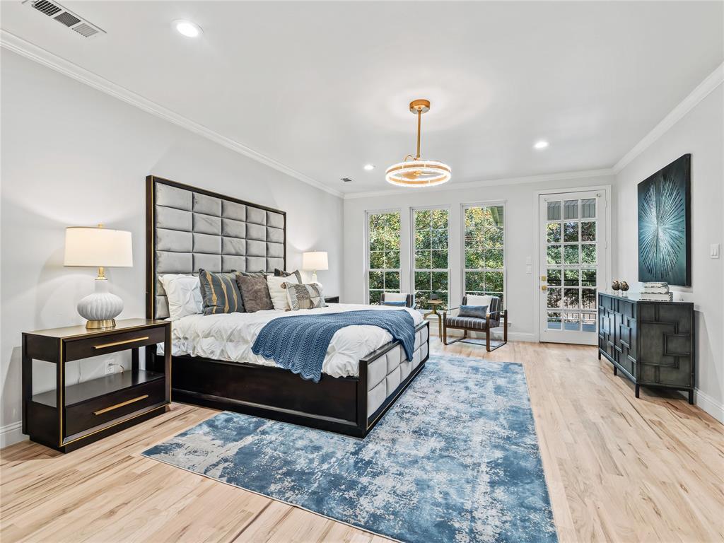 5120 Briar Tree Drive Dallas, TX 75248 - Photo 27 of 40 a bedroom with a bed and large window