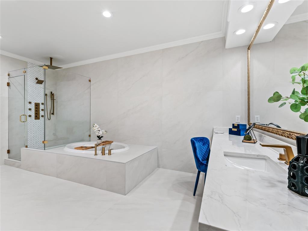 5120 Briar Tree Drive Dallas, TX 75248 - Photo 28 of 40 a bathroom with a tub and a sink