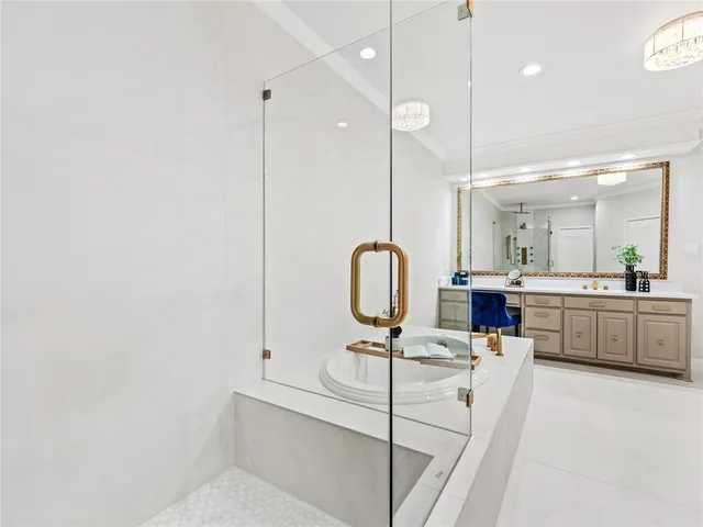 a very nice looking room with a large window and chandelier