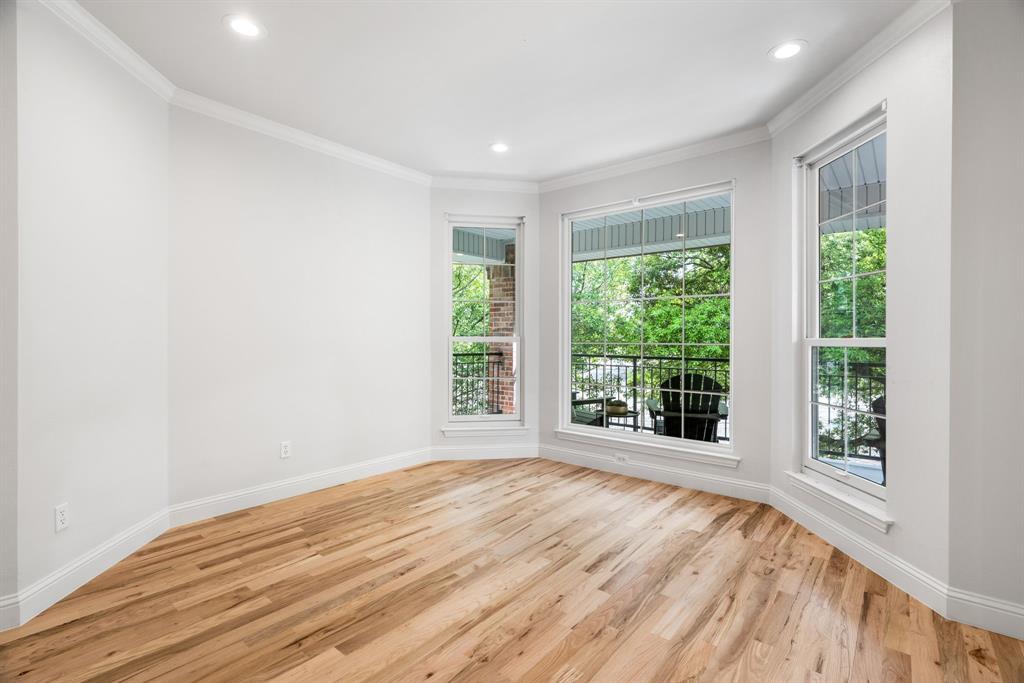5120 Briar Tree Drive Dallas, TX 75248 - Photo 30 of 40 a view of an empty room with wooden floor and a window