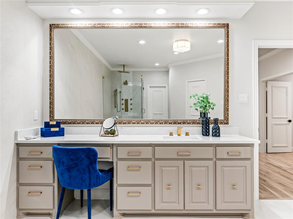 5120 Briar Tree Drive Dallas, TX 75248 - Photo 32 of 40 a bathroom with a sink and a mirror