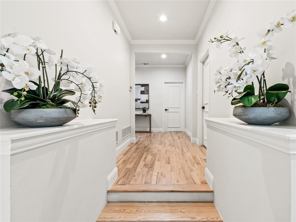 5120 Briar Tree Drive Dallas, TX 75248 - Photo 33 of 40 a view of a hallway with wooden floor and a potted plant