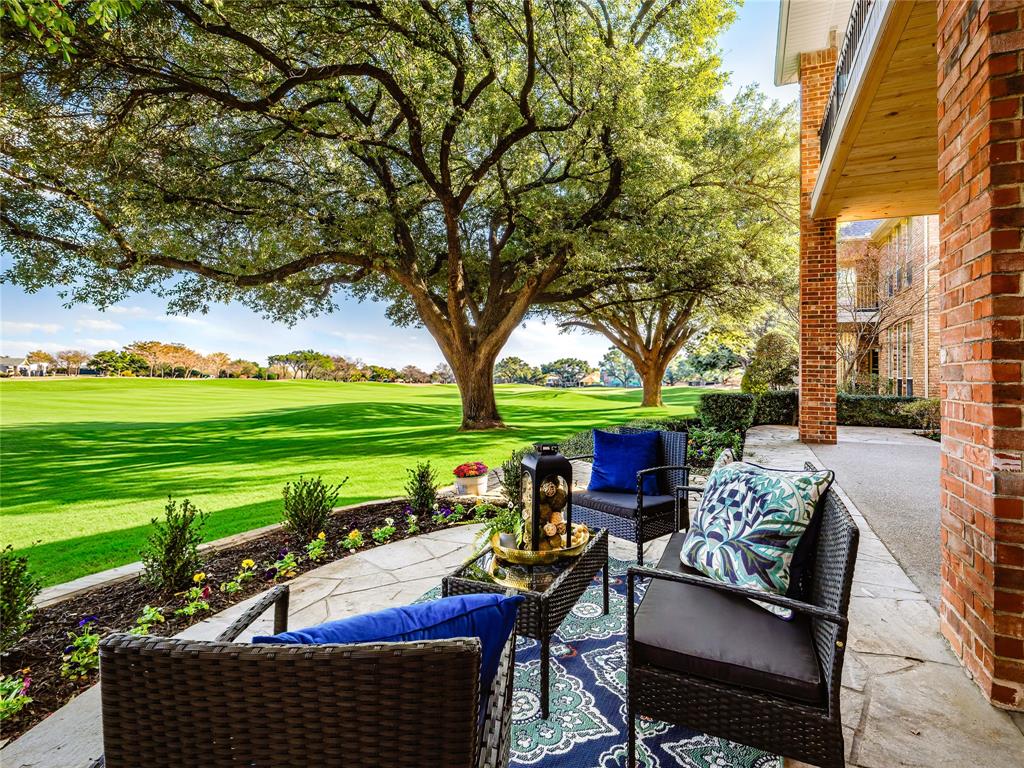 5120 Briar Tree Drive Dallas, TX 75248 - Photo 37 of 40 a view of a patio with table and chairs potted plants and a large tree