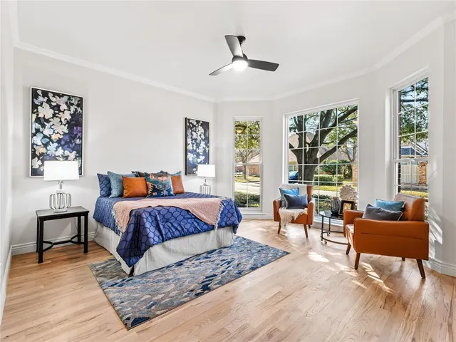 a bedroom with a large bed and a couch